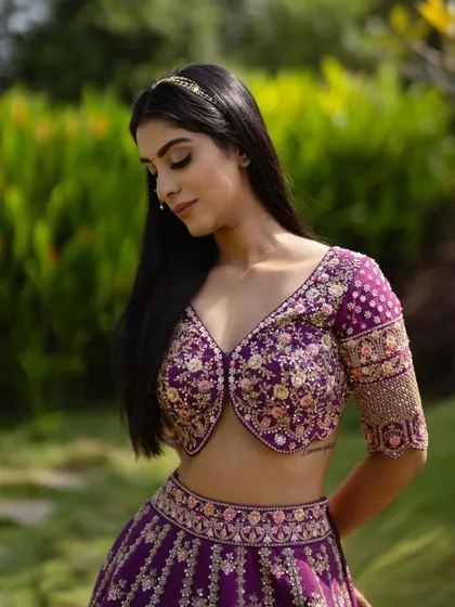 Another angle of this beautiful look. The soft makeup allows the intricate floral embroidery of the blouse to be a key feature.