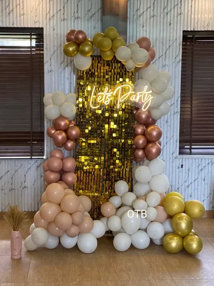 A full view of the "Let's Party" backdrop with the gold sequin wall, showing how it creates a stunning focal point in any room.