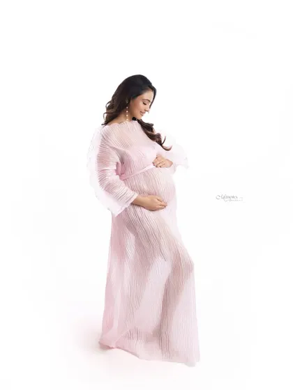 Draped in a sheer pink masterpiece, Pooja redefined grace. This shot captures a moment of quiet reflection, honoring the magic of new beginnings.