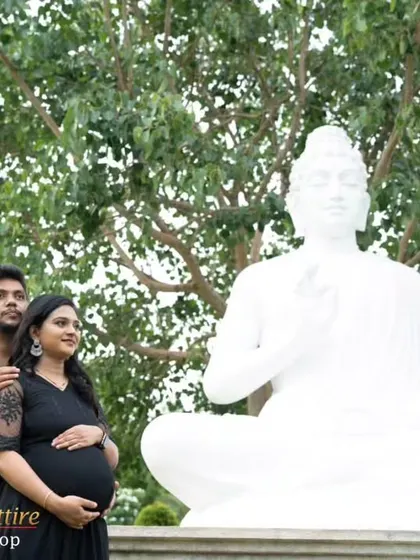 This couple's portrait in matching black outfits creates a powerful and serene image. My black flowy gown with lace sleeves adds a touch of elegance to this peaceful maternity moment.