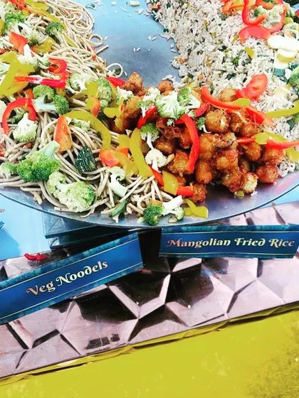 A colourful display of Veg Noodles and Mongolian Fried Rice at a live tava station. This fusion concept is a great way to offer exciting vegetarian Chinese dishes at your event.
