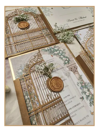 A closer look at the details of our laser-cut invitation, showing the delicate gate design and the custom wax seal with dried baby's breath. It's these small, thoughtful touches that make an invitation truly memorable.