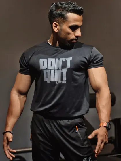 A side profile showing the physique that comes from never quitting. The work I put in every day is the foundation of the coaching I provide to my clients.