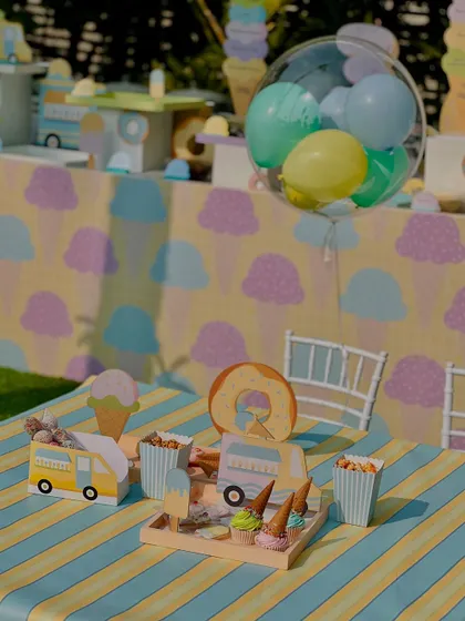 A wide shot of one of the kids' tables, showing the playful mix of food and themed decor.