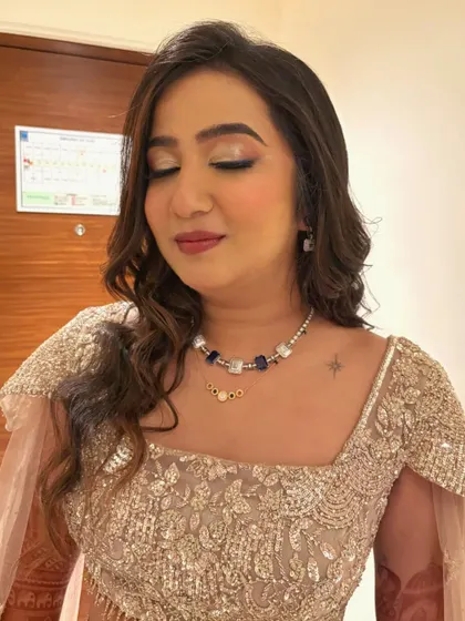 A close-up of the reception makeup. The soft, shimmery eye and perfectly blended base create a dreamy and sophisticated finish.