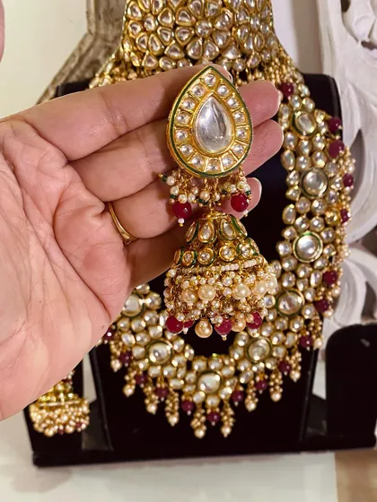 Another angle of the beautiful Kundan jhumka, showing the intricate pearl work. This is part of a complete bridal rental set.