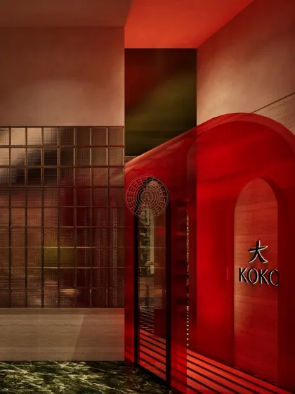 A render of the entrance to Koko, where the glowing red tunnel immediately establishes the restaurant's bold and modern Asian identity.