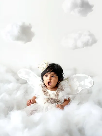 A gasp of surprise! I love capturing the full range of a baby's expressions during our themed photoshoots.