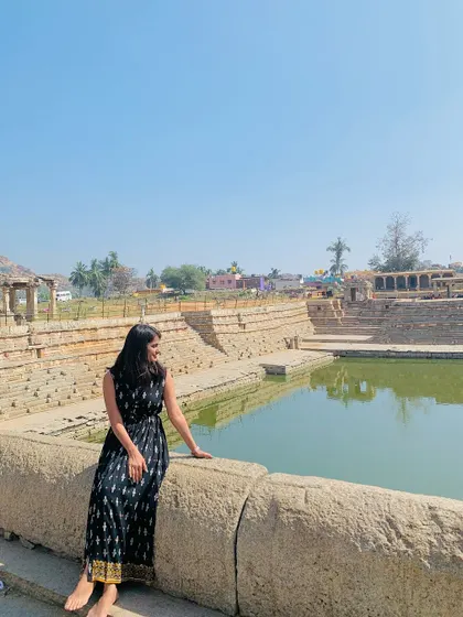 A serene moment by the Pushkarani (temple tank) in Hampi.
