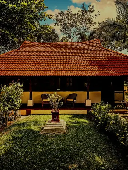 An 18th-century heritage wooden house, now a tranquil accommodation for our guests. Surrounded by lush greenery, it offers an authentic setting for experiencing traditional Kerala Ayurveda and yoga.