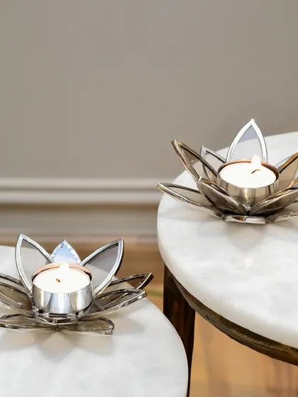Find peace in the chaos with our lotus T-light holders. Inspired by the purity of the lotus flower, these elegant pieces are available in a silver finish.