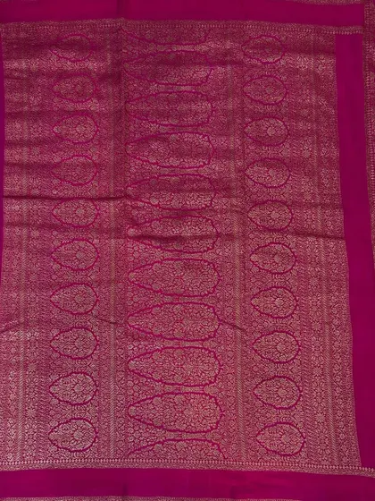 The pallu of the royal blue Bentex Banaras saree, showcasing the intricate weaving.