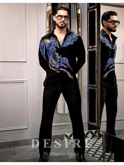 Sleek, bold, effortless. This full-length shot shows how the abstract wave shirt can command a room.