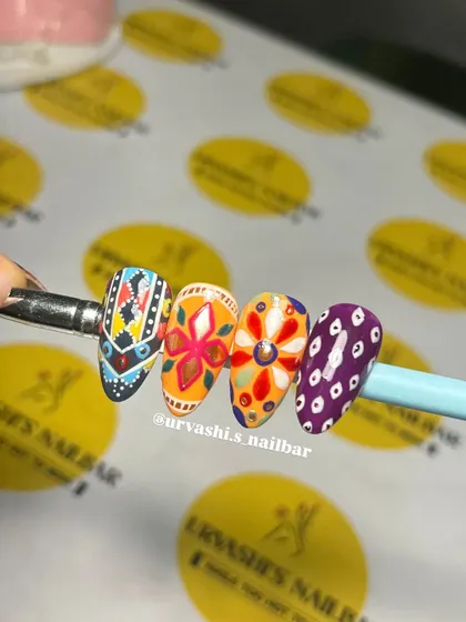Get ready for garba with these Navratri-themed nails. I hand-painted these with vibrant, intricate patterns inspired by traditional chaniya choli designs to make sure your nails are as festive as your outfit.