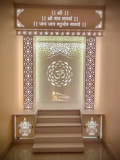 This is one of our custom-built mandir designs, creating a peaceful and divine corner in the home. We used backlit panels with intricate jaali patterns and the Om symbol to create a warm, spiritual glow. The design includes steps and a raised platform, all crafted from high-quality Korian material.