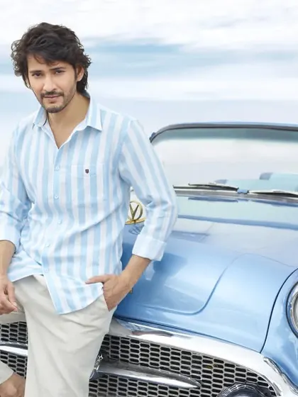 A classic summer lifestyle shot for Otto Clothing with Mahesh Babu. The vintage convertible and beachside location create a relaxed, cool, and aspirational mood for the brand's summer collection.