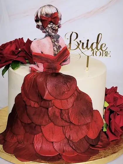 My forever favorite "Bride to be" cake design. The dress is made from individual, hand-placed wafer paper petals, creating a stunning, couture-inspired look.