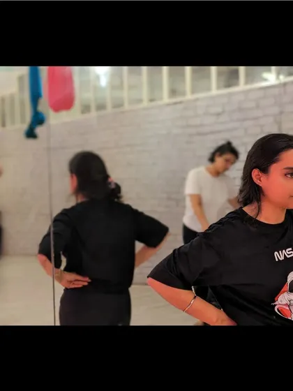 A student listens intently during a contemporary basics class. We believe in the power of focused learning and mindful movement.