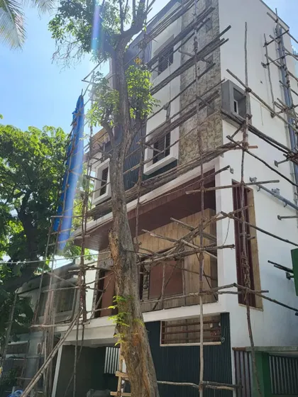 A clear shot of the facade work, showing the contrast between the finished and unfinished sections.
