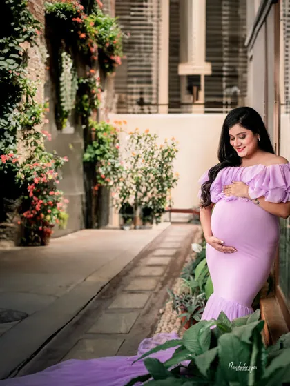 A solo portrait in a rustic, European-style alleyway with greenery. This shows the variety of outdoor locations we can use for your shoot.
