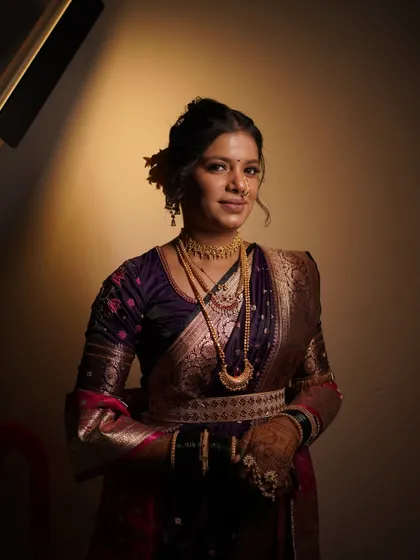 Another beautiful shot of the bride's engagement look. The lighting highlights her features and the beautiful embroidery on her blouse.