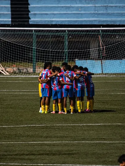 The 'RAM TEAM' in a huddle, a symbol of our unity and teamwork.