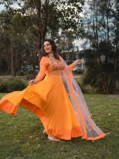 A joyful, twirling shot that captures the energy of this bright and happy outfit.