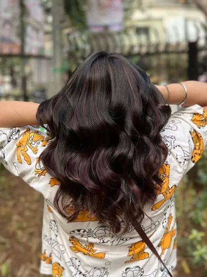 Our Cherry Choco balayage blend. This look combines deep chocolate tones with hints of cherry red for a subtle yet playful effect.