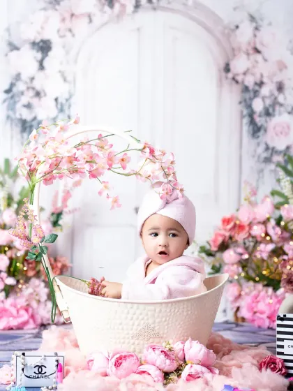 A curious expression from a six-month-old baby during her themed sitter session. I love capturing these moments of discovery and wonder.
