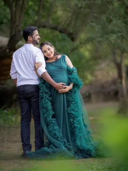 A quiet moment of connection, with the mom-to-be leaning back into her partner's embrace. These are the simple, beautiful memories I aim to capture.