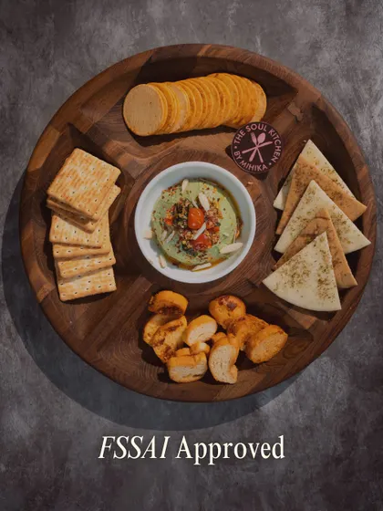 Our FSSAI approval is your assurance of quality and safety. This platter, featuring our Caprese dip with assorted crackers, represents our commitment to trustworthy, homemade food.