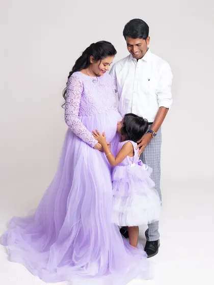 The whole family is excited to meet the new baby. This shot from a maternity session captures the love and anticipation beautifully.