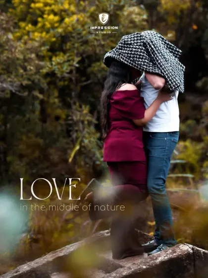 A stolen, intimate moment under a jacket, hidden away in nature. This creative shot is all about privacy and connection, creating a feeling that the world has faded away and only they exist.