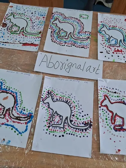 Here is a collection of the finished Aboriginal-style art pieces. Displaying their work gives the children a sense of pride and accomplishment.