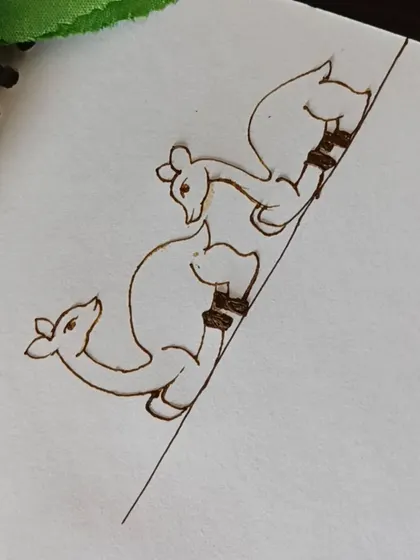 The initial outline of the deer figures. I teach simple shapes to help students draw animals confidently.
