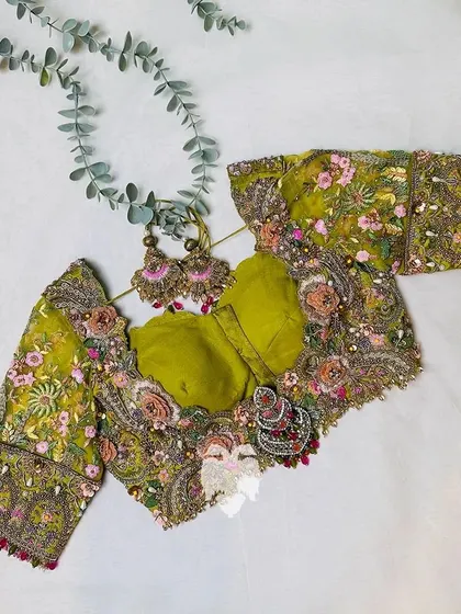 The full blouse and earring set, showcasing maximalism at its finest.