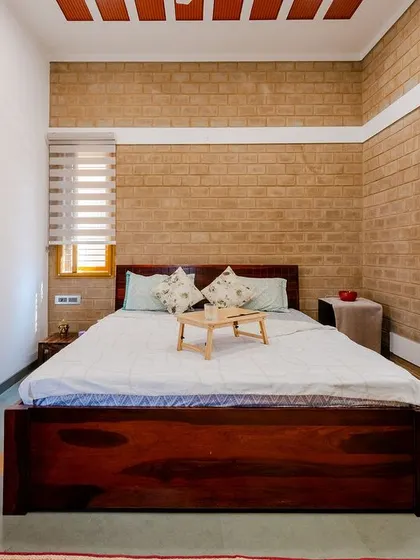 A bedroom should be a sanctuary. In the Audumbara project, I used the raw texture of earth block walls, the warmth of a clay tile ceiling, and the comfort of a sunlit bay window seat to design a room that feels calm, natural, and deeply restful.