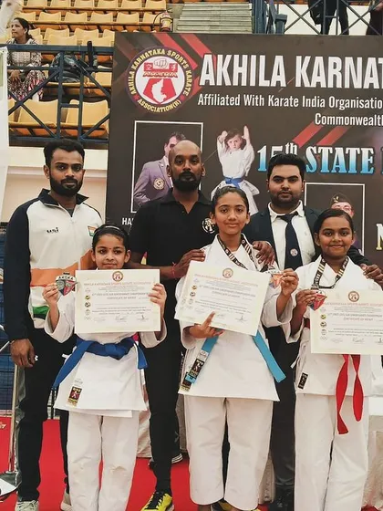 Our students proudly display their certificates and medals after a successful performance at the 15th State Level Karate Championship.
