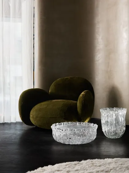A moody and sophisticated corner of the Ventura showroom, where we paired a dark, velvet armchair with sculptural glass accessories. The play of light and shadow creates an intimate, luxurious feel.