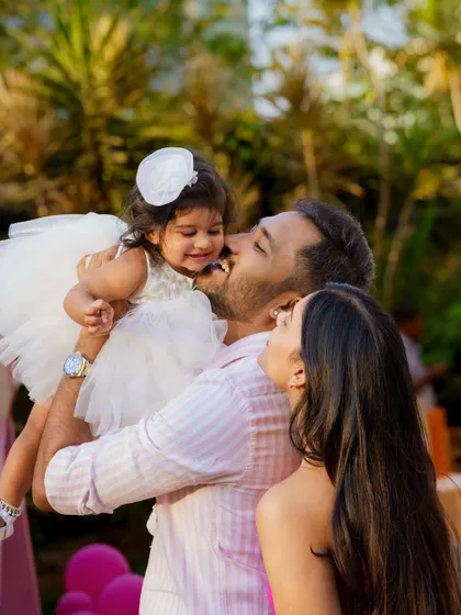 A candid moment of pure love and joy between parents and their daughter at her birthday party. These are the unscripted, emotional moments we love to capture during events.