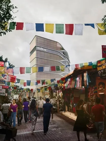 A street view montage of the Hilton Kathmandu, framed by traditional prayer flags. This image illustrates our goal of creating architecture that resonates with its cultural context.