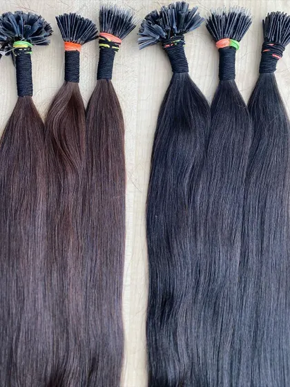 A side-by-side comparison of our I-Tip extensions in dark brown and natural black. We offer a range of colors to ensure a perfect match for your clients.