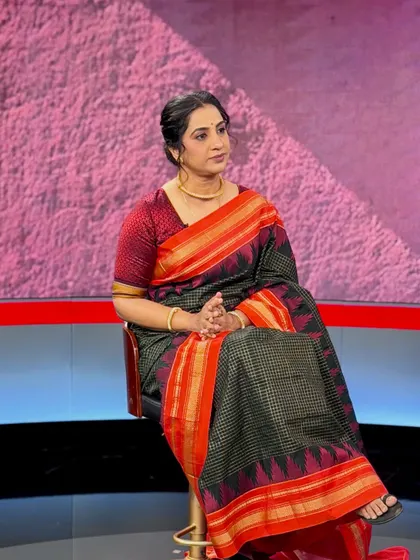 A candid shot during the interview. The makeup is designed to be long-lasting and camera-friendly, ensuring she looks her best throughout the shoot.