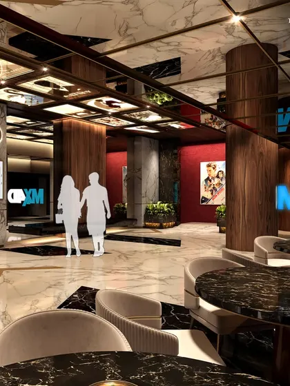 The entrance to the MX4D theater, where guests can enjoy an immersive cinematic experience. The lobby features dark marble tables and comfortable seating, creating a sophisticated lounge area before the show.