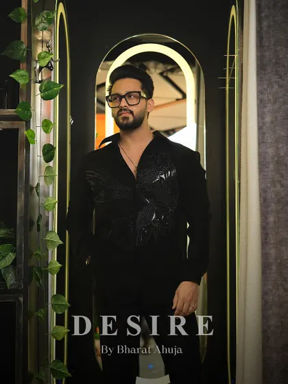 This shot captures the quiet confidence of the black-on-black embroidered shirt, a piece for the man who appreciates subtle luxury.