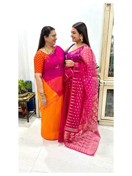 With my main, my maa. For Diwali, I wore a pink Jamdani saree while she wore a stunning orange and pink silk, a beautiful moment of us in our festive handlooms.