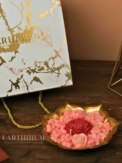 A beautiful pink floral Urli candle, shown here with its elegant gift bag. It’s a complete, thoughtful gift for any occasion, from birthdays to housewarmings.