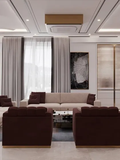 A spacious drawing room featuring a large L-shaped sofa and bold abstract art. The design uses a neutral color palette with deep brown accents to create a sophisticated and inviting atmosphere.