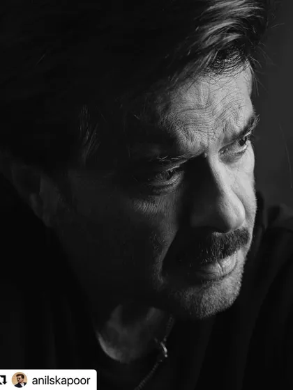 A close-up profile of Anil Kapoor, showing the texture and salt-and-pepper details in his hair.