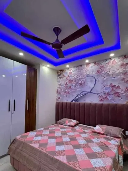 A duplicate of media 211, this bedroom combines a soft floral wallpaper with bold ceiling lights for a unique and personalized look.